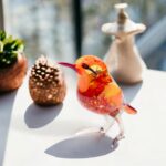 Oranje vogel van glas sfeer